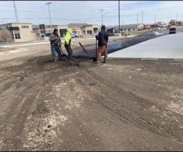 men laying asphalt
